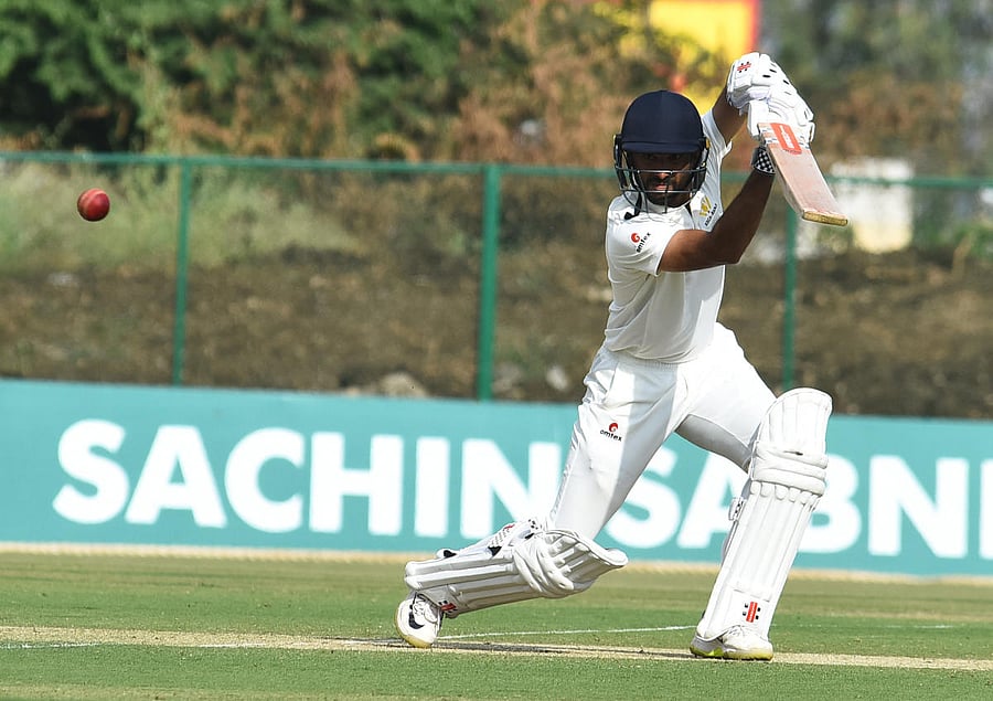 Karnataka's KV Siddharth drives one to the fence during his unbeaten ton against Mumbai on Tuesday. DH PHOTO/ TAJUDDIN AZAD