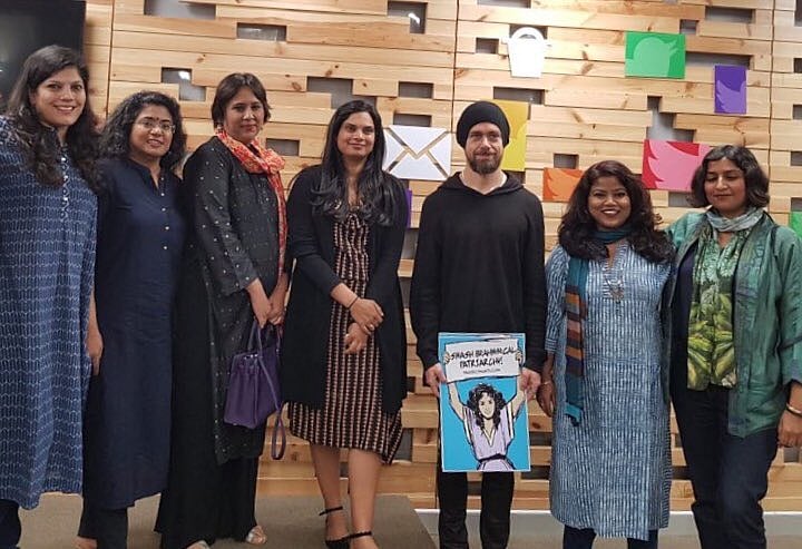 Twitter CEO Jack Dorsey with a poster saying "Smash Brahmin Patriarchy" poses for a photo. (Credit: Twitter)