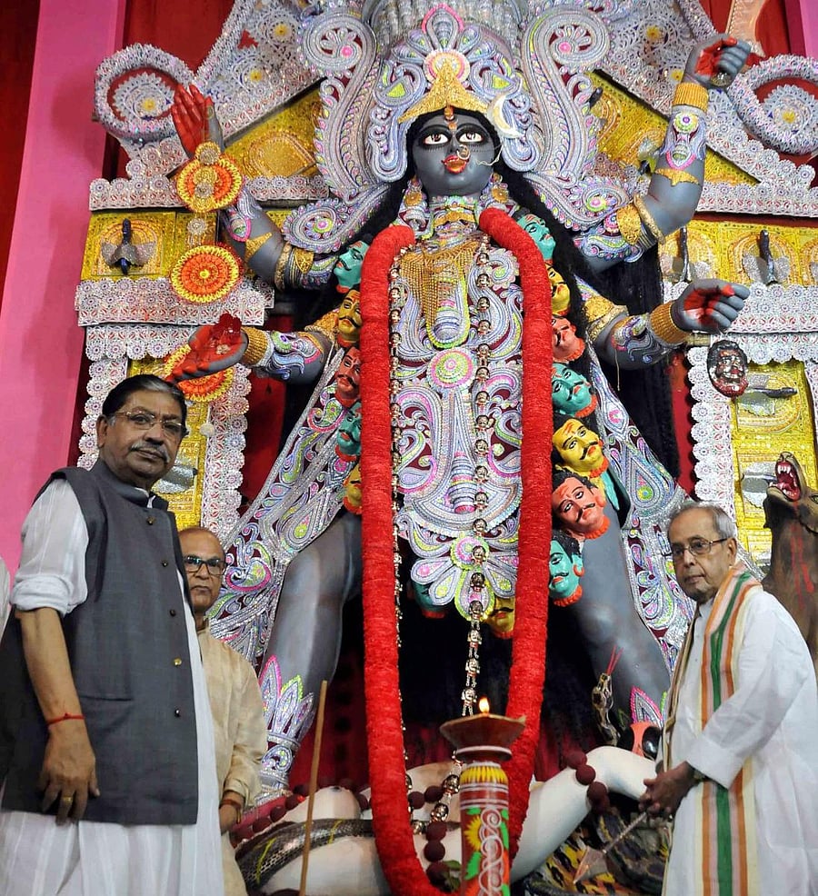 West Bengal Congress president Somen Mitra with former President Pranab Mukherjee. PTI