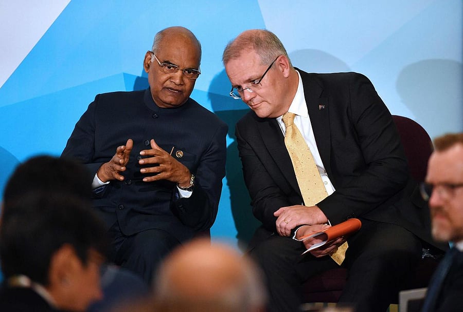 India's President Ram Nath Kovind (L) talks to Australia's Prime Minister Scott Morrison at the Australian Financial Review (AFR) India Business Summit in Sydney on Thursday. AFP