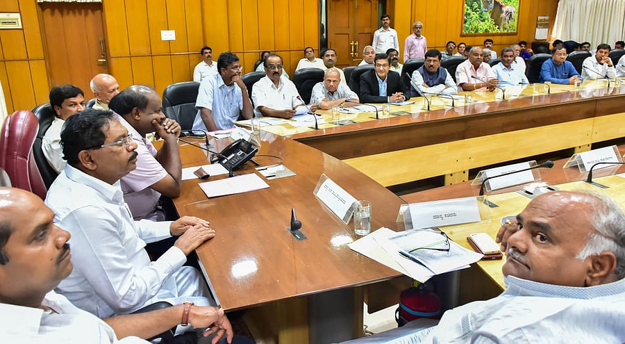 Chief Minister Kumaraswamy speaks at a meeting of sugar factory owners in Bengaluru on Thursday. Deputy Chief Minister Parameshwara is also seen.