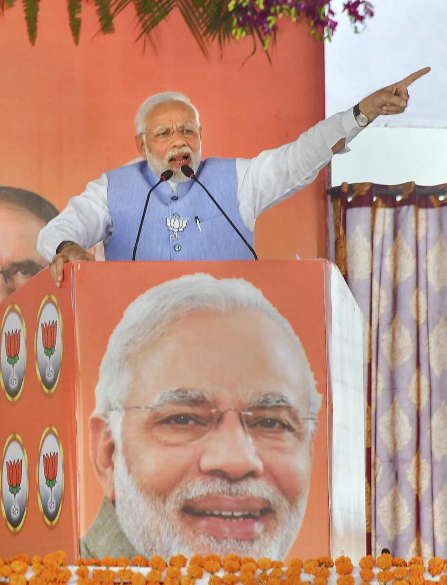 Prime Minister Narendra Modi addresses a public meeting for Madhya Pradesh Assembly elections campaign, in Vidisha on Sunday. PTI
