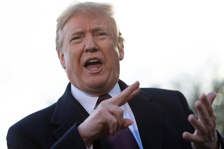 In this file photo taken on November 20, 2018 US President Donald Trump speaks to the press as he departs the White House in Washington, DC. Democrats intend to probe US President Donald Trump's financial ties to determine whether they are the "hidden han