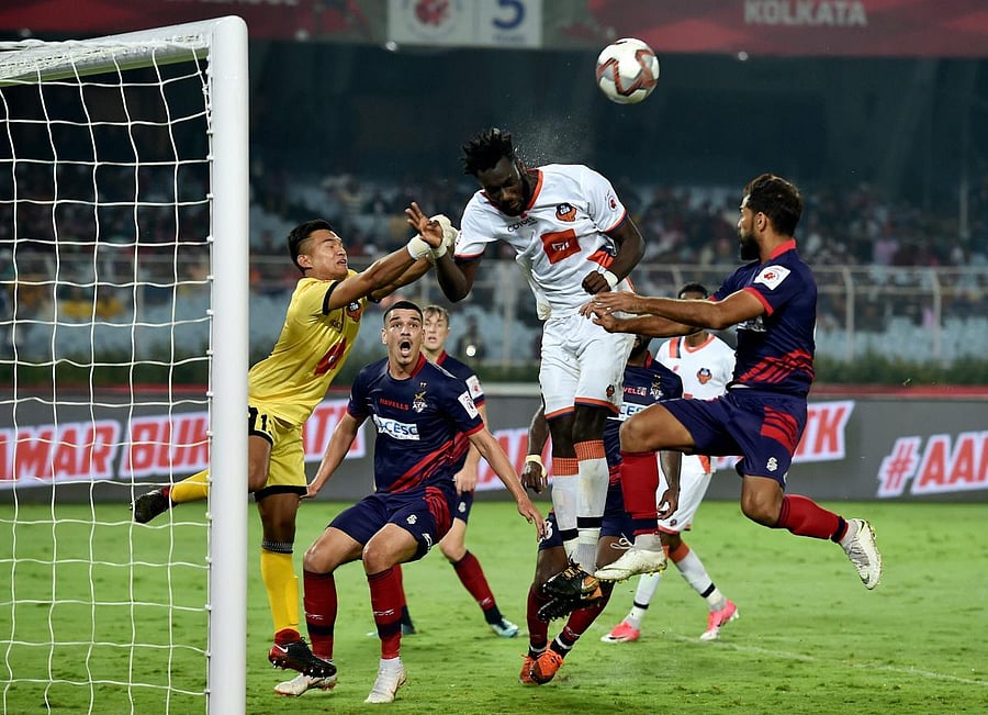 FC Goa and ATK players vie for the ball during their ISL match in Kolkata on Wednesday. PTI