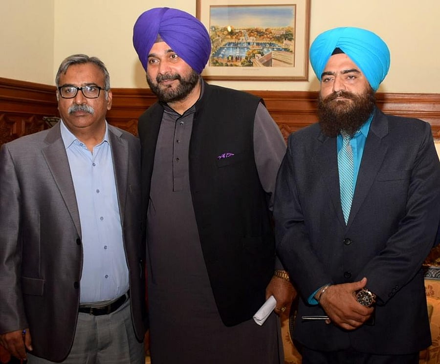 The photo of Gopal Singh Chawla with Navjot Singh Sidhu. Facebook photo.