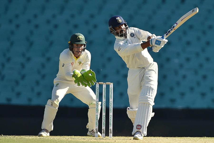 Murali Vijay hits a shot on the fourth day of the tour match against Cricket Australia XI at the SCG in Sydney on December 1, 2018. (Photo by PETER PARKS / AFP)