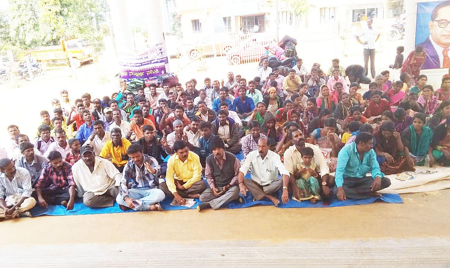 District Dalit Sangharsha Samithi members stage a protest in front of the Mini Vidhana Soudha in Virajpet on Saturday.