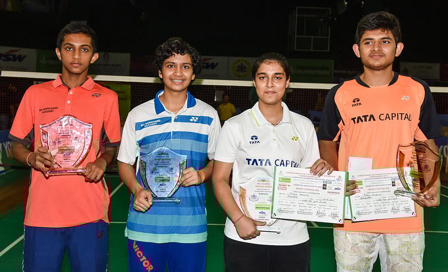 TRIUMPHANT: Winners of Sub-junior national badminton singles titles. FROM LEFT: Sai Vishnu Pullela (U-15), Tasnim Mir (U-15), Aditi Bhatt (U-17) and Rohan Gurbani (U-17). DH PHOTO