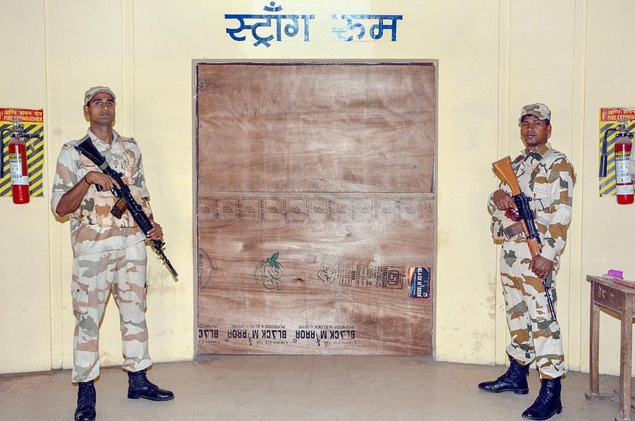 Indo Tibetan Border Police Force jawans guard outside a strong room where Electronic Voting Machines (EVM) are kept, Madhya Pradesh Assembly elections, in Jabalpur, Thursday, Nov 29, 2018. (PTI Photo)