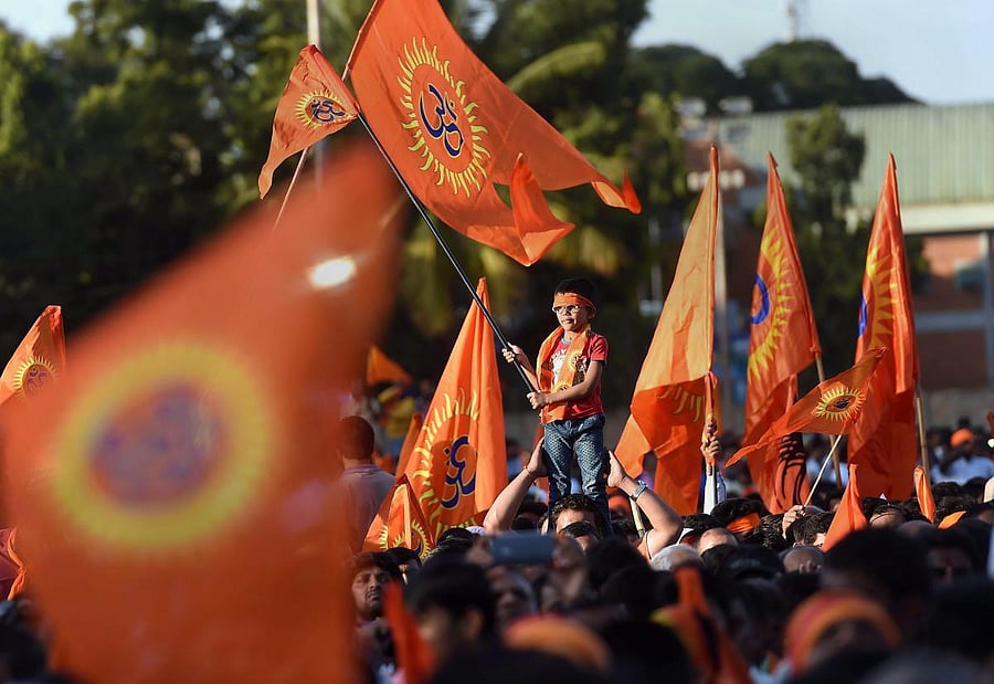 VHP activists during a procession in prior to their 'Janagraha Rally', organised to push for the construction of the Ram Temple in Ayodhya, in Bengaluru. (PTI Photo)