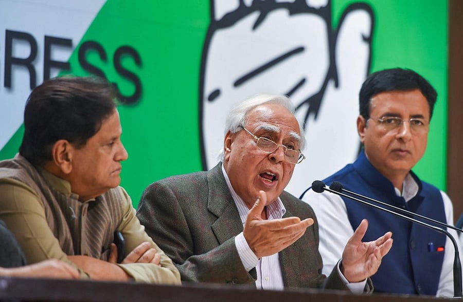 Congress leaders Kapil Sibal, Ahmed Patel and Randeep Surjewala during a special press briefing in New Delhi on Saturday. PTI
