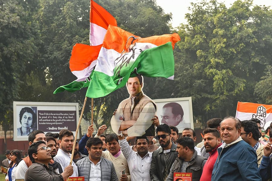 Congress party workers celebrate the party's good show in the Assembly elections of Rajasthan, Chhattisgarh and Madhya Pradesh, at AICC headquarters in New Delhi. PTI