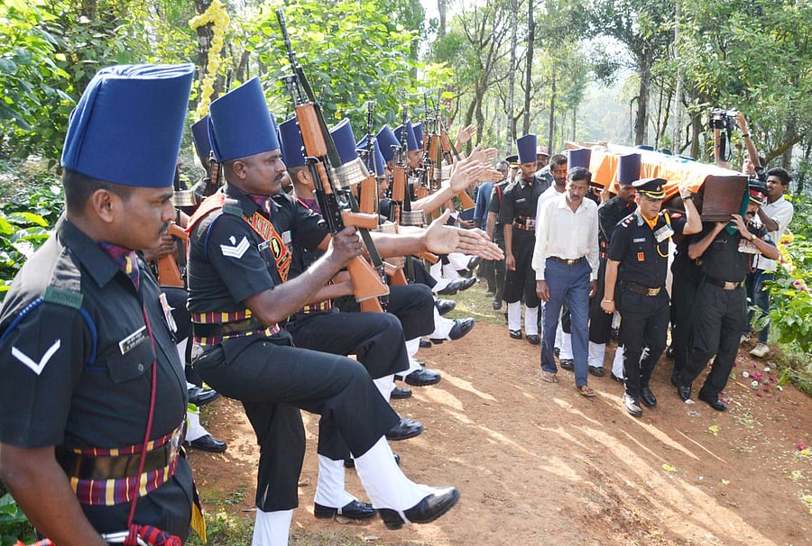 Mortal remains of Lt General (Retd) B C Nanda being carried by military officials to its place of burial in Madikeri, on Thursday.