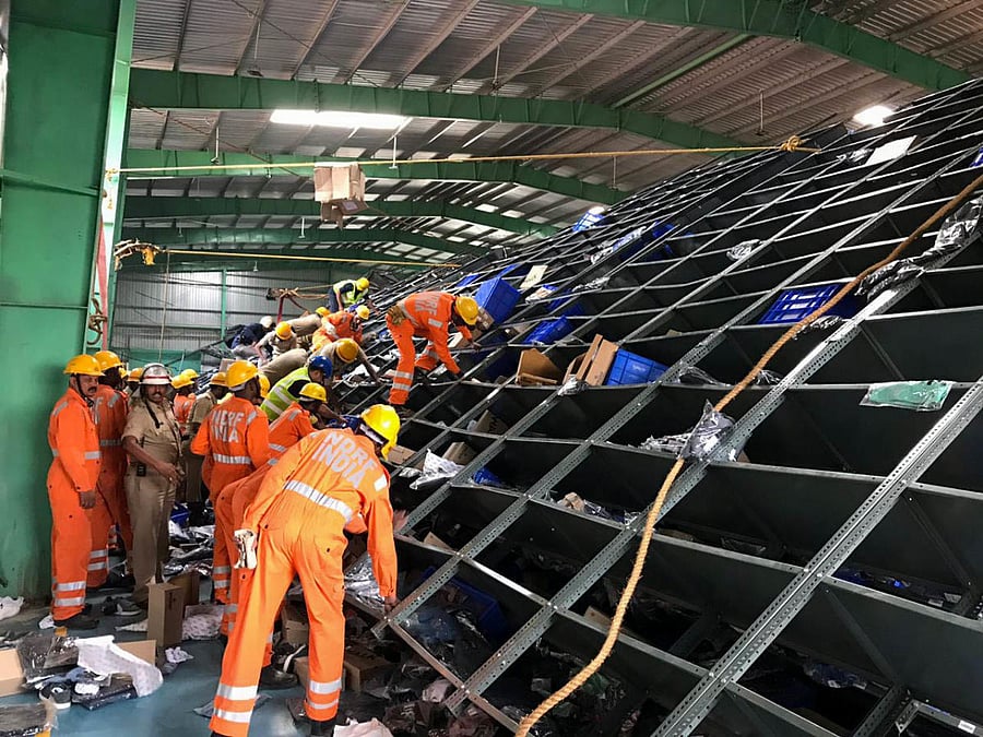An NDRF team looks for trapped workers at Holisol Logistics Pvt Ltd in Seegehalli near Whitefield.