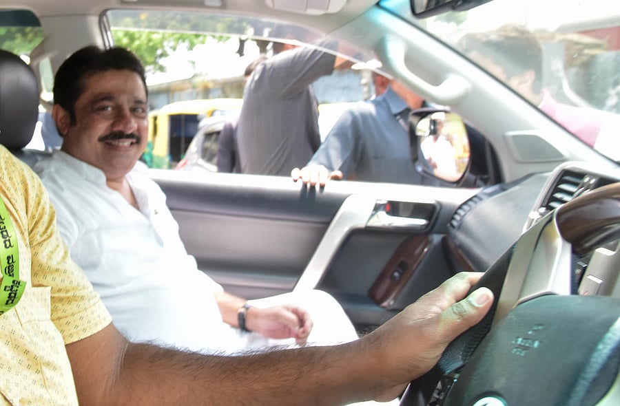 In this file photo, Zameer Ahmed Khan arrives in his high-end car to file papers as a Congress nominee for the Chamarajpet seat.