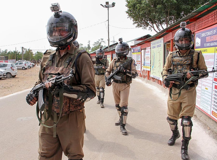 Jammu: Security personnel stand guard at Yatri Niwas base camp ahead of the annual Amarnath Yatra, which commences tomorrow, in Jammu on Tuesday, June 26, 2018. PTI photo.