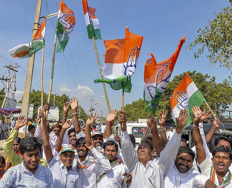 Congress supporters celebrate party candidate V S Ugrappa's win in the Bellary Loksabha by-poll election, in Bellary, Karnataka, on Tuesday. PTI
