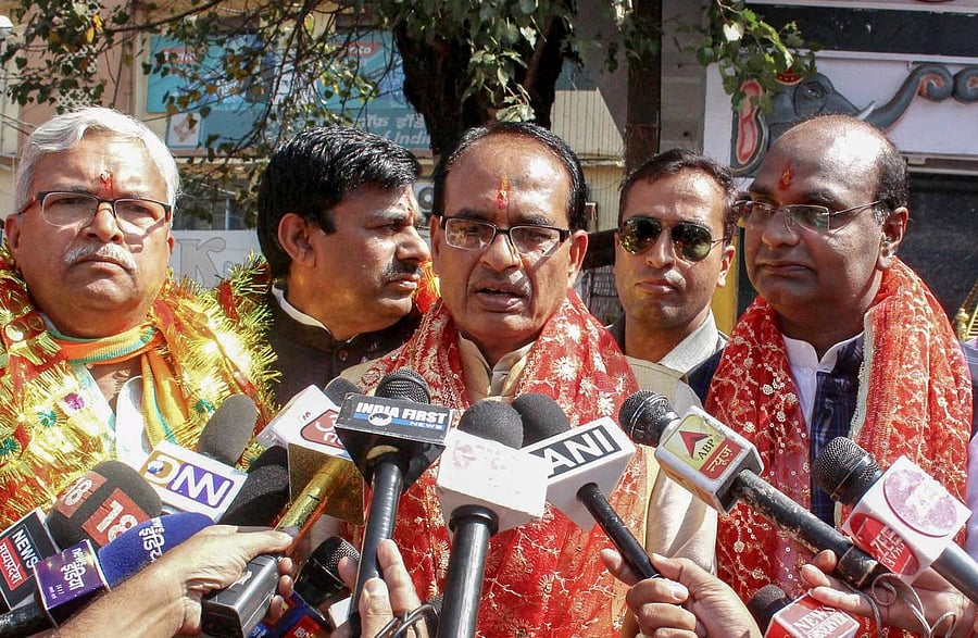 Madhya Pradesh Chief Minister Shivraj Singh Chouhan speaks to mediapersons after offering prayer with Bhopal BJP candidates before filing their nomination papers and launch of the election campaign for state Assembly elections, in Bhopal on Friday. PTI