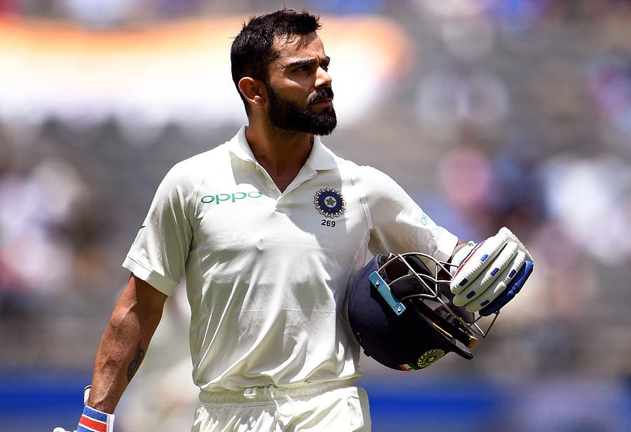 Virat Kohli walks off after being dismissed by Australia on the third day of the second cricket Test match in Perth. AFP.