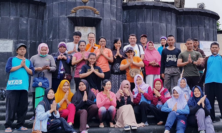 Participants of the yoga poses for a photo at Indian Embassy as part of week long India Cultural Week in Jakarta. (Twitter/@iccjkt)