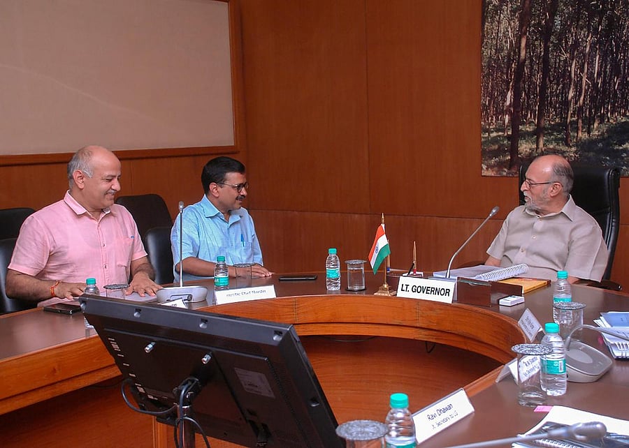Delhi Chief Minister Arvind Kejriwal and his deputy Manish Sisodia (left) meet Lt Governor Anil Baijal (right), in New Delhi on Frida. PTI