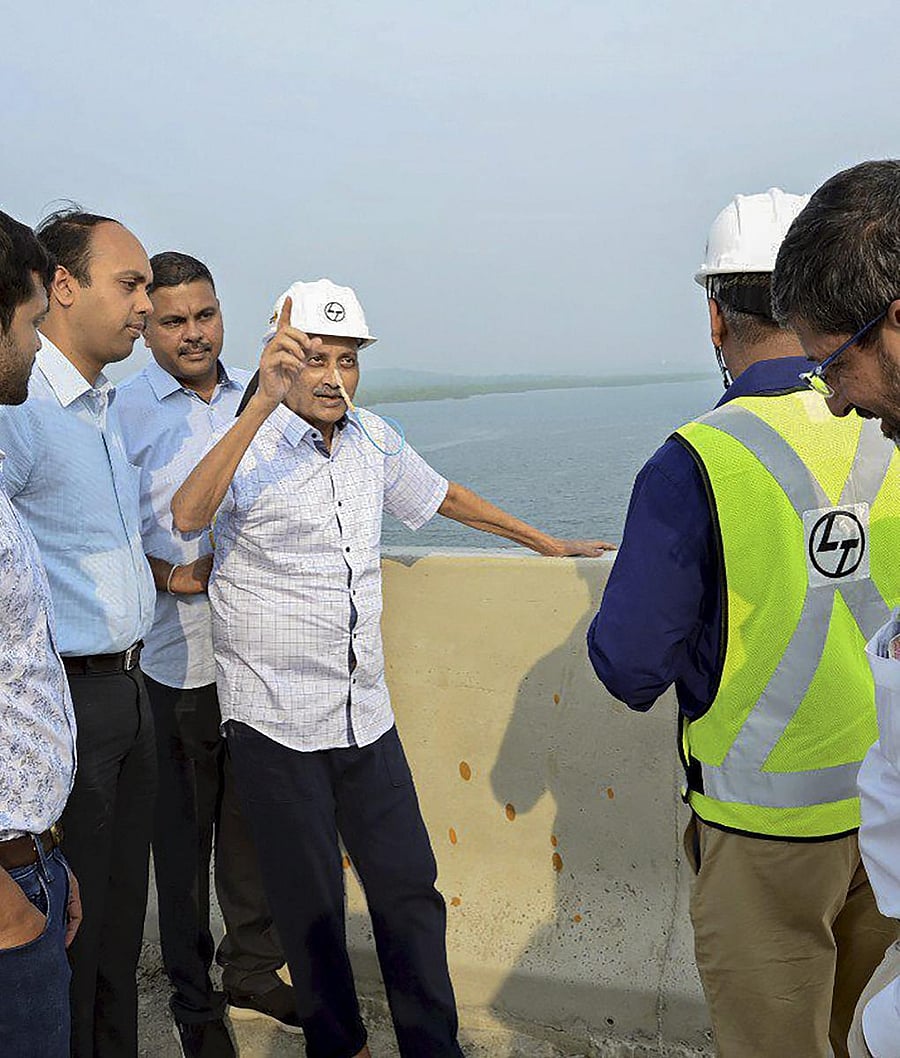 Goa Chief Minister Manohar Parrikar inspects the work of an under-construction bridge on Mandovi River, in Panaji on Sunday. PTI