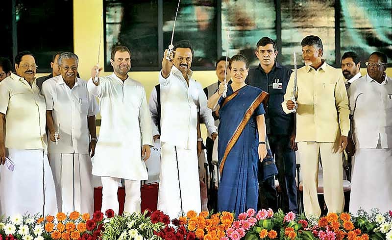 UPA Chairperson Sonia Gandhi, Congress President Rahul Gandhi, DMK chief M K Stalin, Andhra Pradesh Chief Minister N Chandrababu Naidu and Kerala Chief Minister Pinarayi Vijayan with swords that were presented at the public meeting after unveiling of bronze statue of M Karunanidhi in Chennai on Sunday. DH Photo