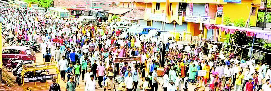 Public take out a protest rally against toll collection in Belmannu on Thursday.