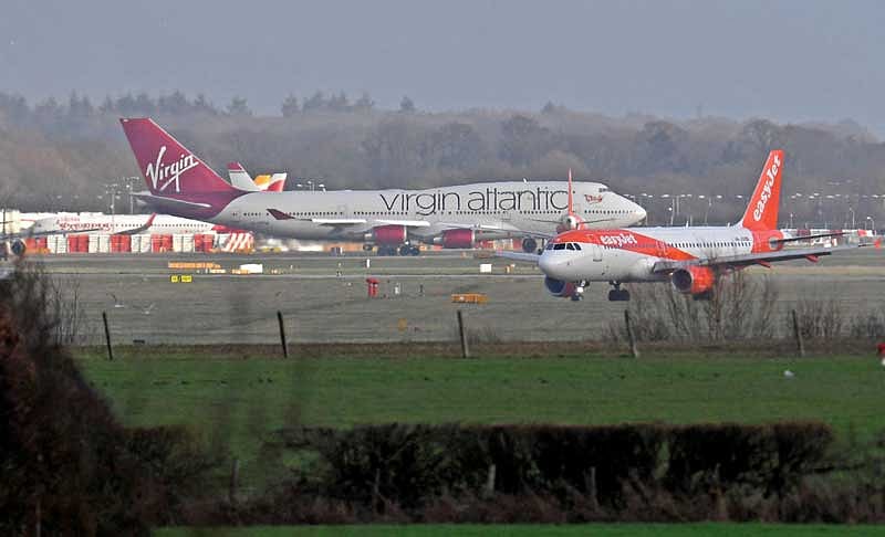 Aeroplanes taxi before and after taking-off and landing at Gatwick Airport, after the airport reopened to flights following its forced closure because of drone activity, in Gatwick, Britain. (Reuters Photo)