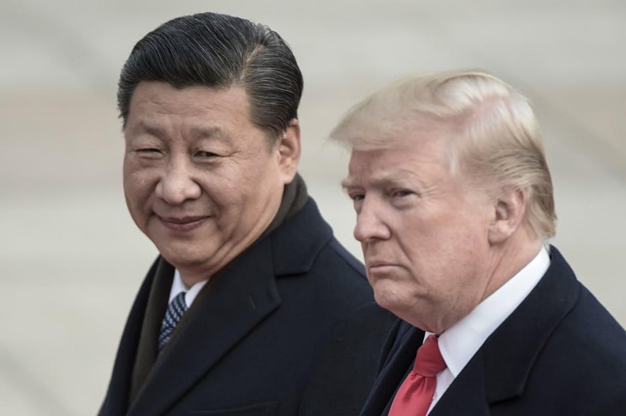 (FILES) In this file photo taken on November 9, 2017, China's President Xi Jinping (L) and US President Donald Trump attend a welcome ceremony at the Great Hall of the People in Beijing. - US President Donald Trump on December 29, 2018 touted "big progres