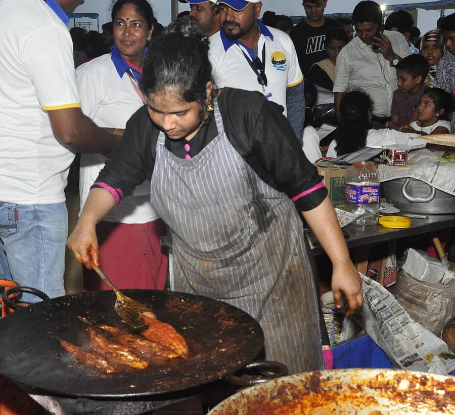 Fish delicacies being prepared during the Matsyamela on Malpe beach.