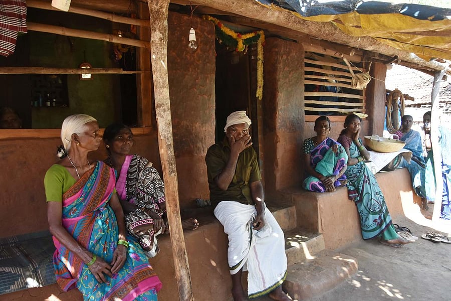 Fear stricken: The family of Beerappa (third from left) is crestfallen after losing two members to the monkey fever at Kanchikai village in Sagar taluk on Saturday. (Right) A nurse treats a resident at Aralagodu village in Sagar taluk. dh photos/Shivamogg