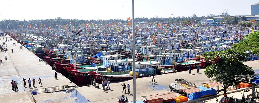 Deep sea fishing boats remain anchored at Malpe harbour