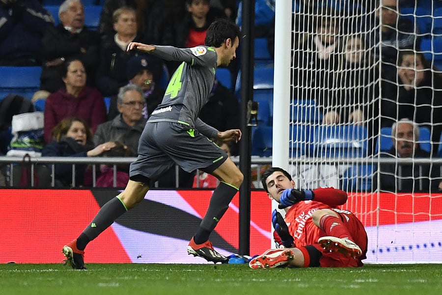 Real Sociedad's Ruben Pardo Gutierrez (left) scores past Real Madrid keeper Thibaut Courtois during their La Liga clash on Sunday. AFP