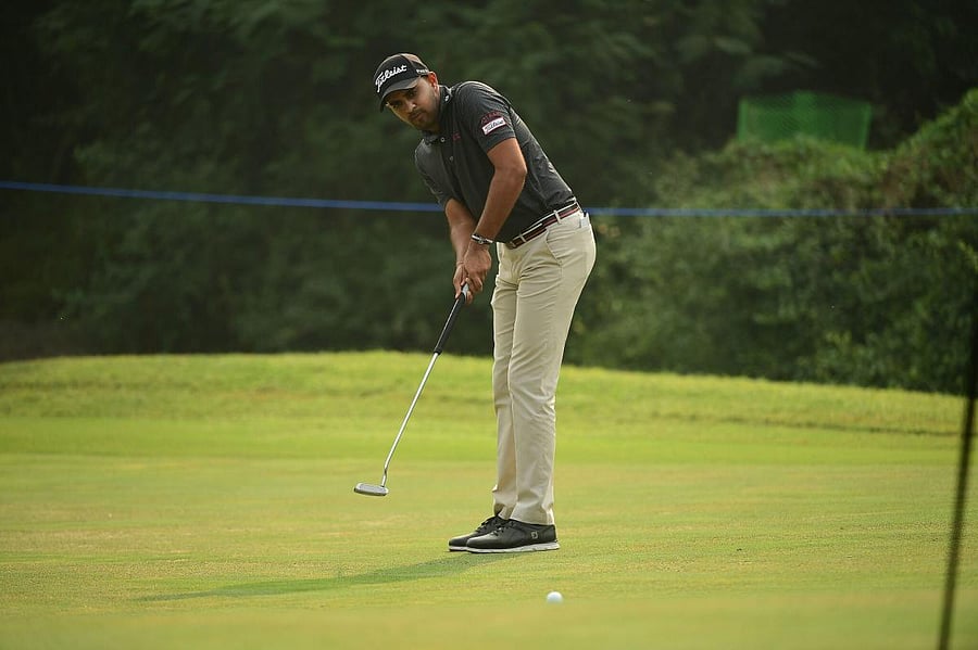 Khalin Joshi putts during the third round of the Panasonic Open India on Saturday. ASIAN TOUR 