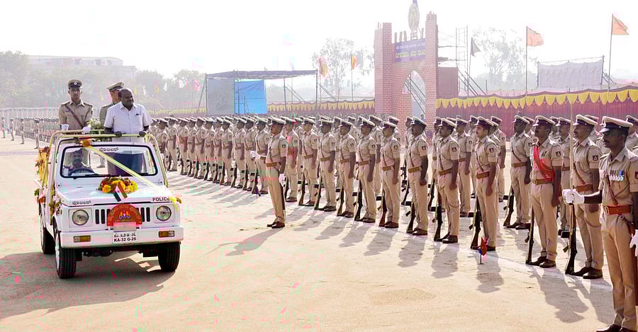 Chief Minister H D Kumaraswamy receives the guard of honour by graduating 41 Battalion of Police Sub-Inspectors at Police Parade Ground, in Mysuru on Monday.