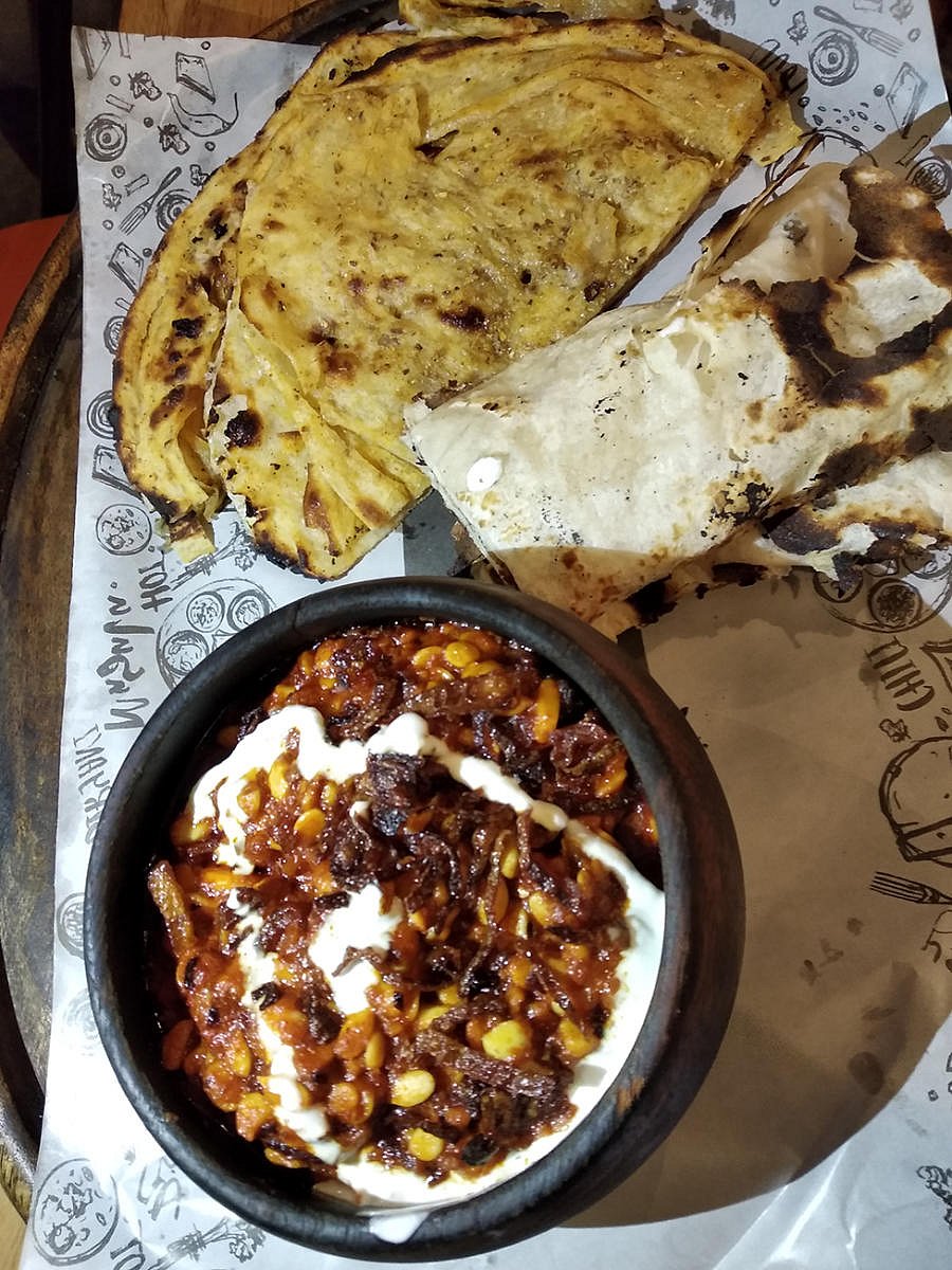 Maal-a-Maal Dry Fruit gravy paired with Chur Chur Naan and Malai Naan is a must-try here.