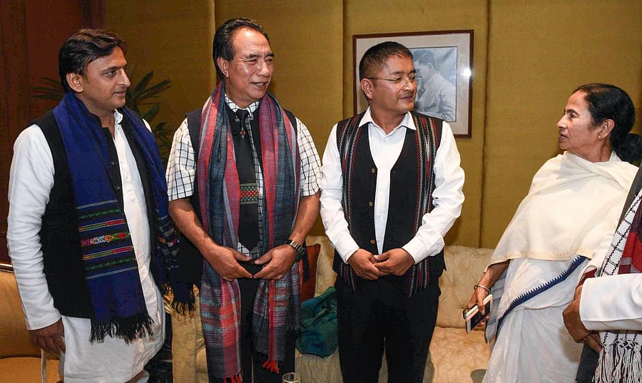Mamata Banerjee interacts with SP chief Akhilesh Yadav and other leaders at a city hotel in Kolkata ahead of the mega opposition rally. PTI photo.