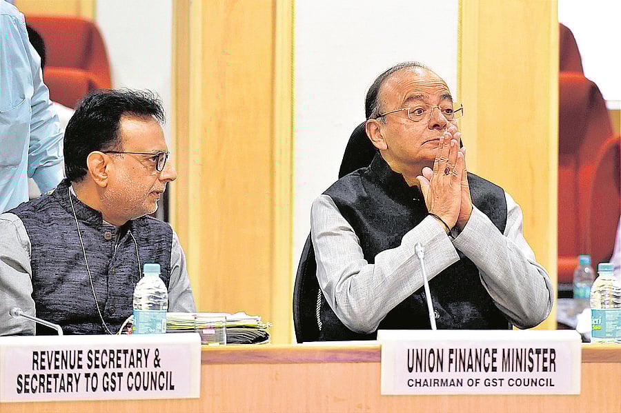 Union Finance Minister Arun Jaitley and Revenue Secretary Hasmukh Adhia (L) at the 22nd meeting of the GST council in New Delhi in 2017. Credit: PTI Photo/Manvender Vashist