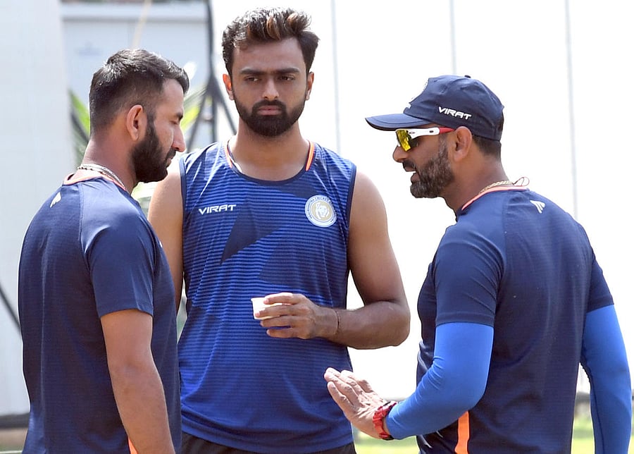 Saurashtra batsman Cheteshwar Pujara (left), captain Jaydev Unadkat (centre) and coach Sitansu Kotak ahead of their Ranji Trophy semifinal against Karnataka. DH Photo/ Srikanta Sharma R