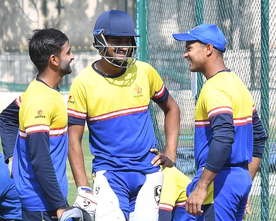 WHO'S IN, WHO'S OUT? Karnataka's opening batsmen R Samarth, D Nischal and Mayank Agarwal share a light moment during a practice session in Bengaluru on Wednesday. DH Photo/ Srikanta Sharma R