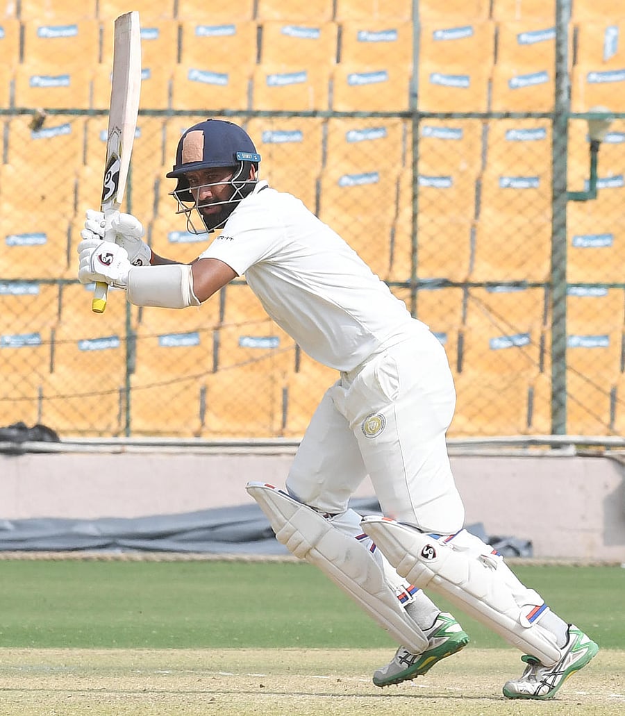 Saurarshtra's Cheteshwar Pujara en route on his unbeaten 108 against Karnataka at the M Chinnaswamy Stadium in Bengaluru on Sunday. DH Photo/ Srikanta Sharma R