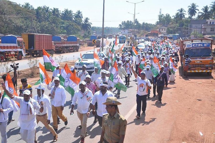 Congress workers take out a padayatra from Talapady to Pumpwell on Monday.