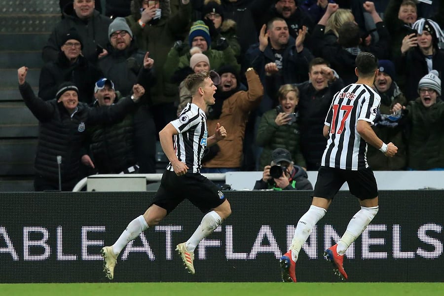 Newcastle United's Scottish midfielder Matt Ritchie (L) celebrates after scoring their second goal from the penalty spot during the English Premier League football match between Newcastle United and Manchester City at St James' Park in Newcastle-upon-Tyne