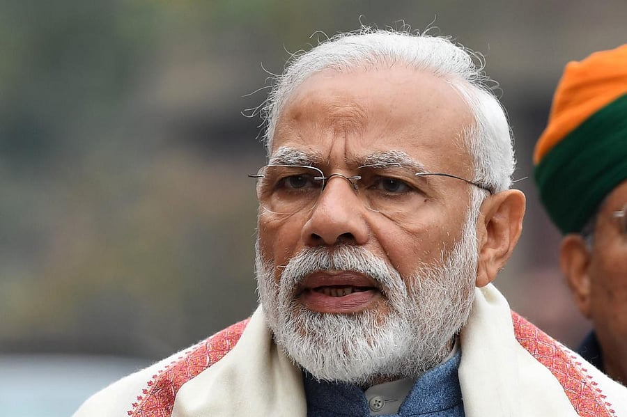 Prime Minister Narendra Modi addresses the media after his arrival at parliament for a budget session in New Delhi. AFP.