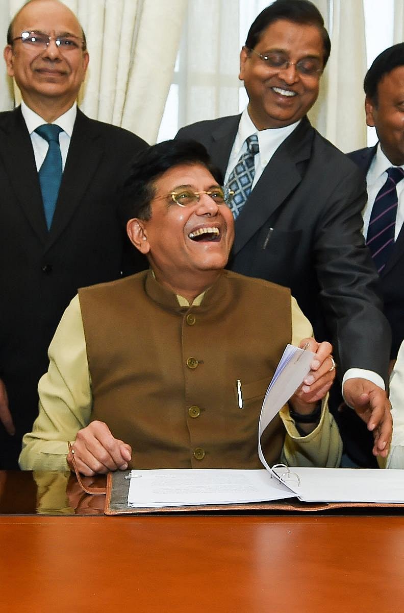 Piyush Goyal gestures while giving final touches to the interim Budget at North Block in New Delhi. PTI