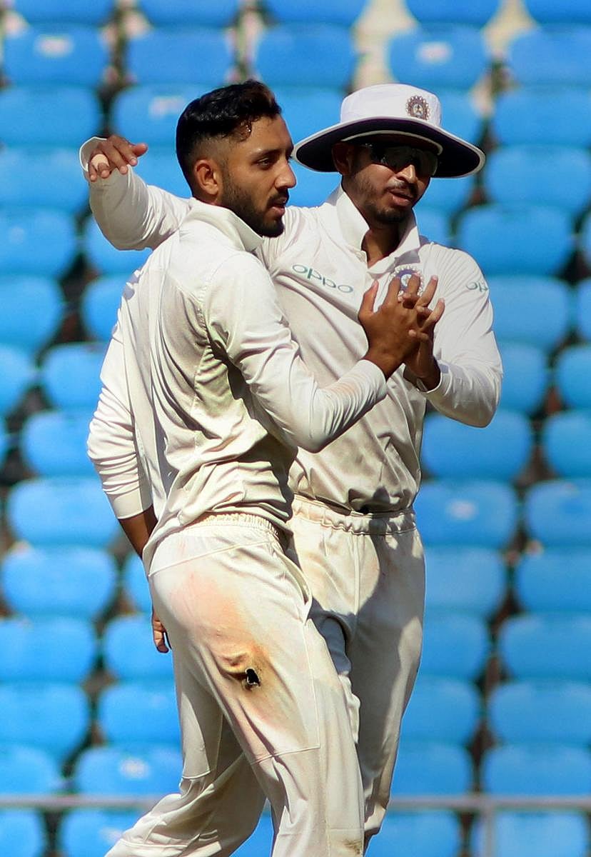 Rest of India bowler Dharmendrasinh Jadeja (left) celebrates the dismissal of Vidarbha batsman Ganesh Satish on the second day of the Irani Cup in Nagpur on Wednesday. PTI