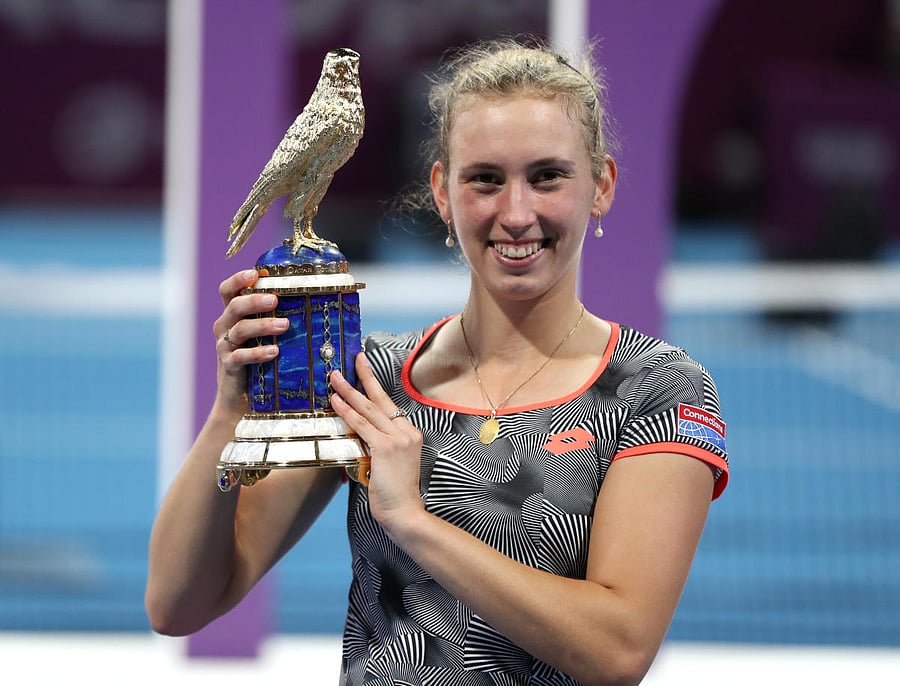 Belgium's Elise Mertens poses with the Qatar Open trophy after beating Simona Halep in the final on Saturday. REUTERS