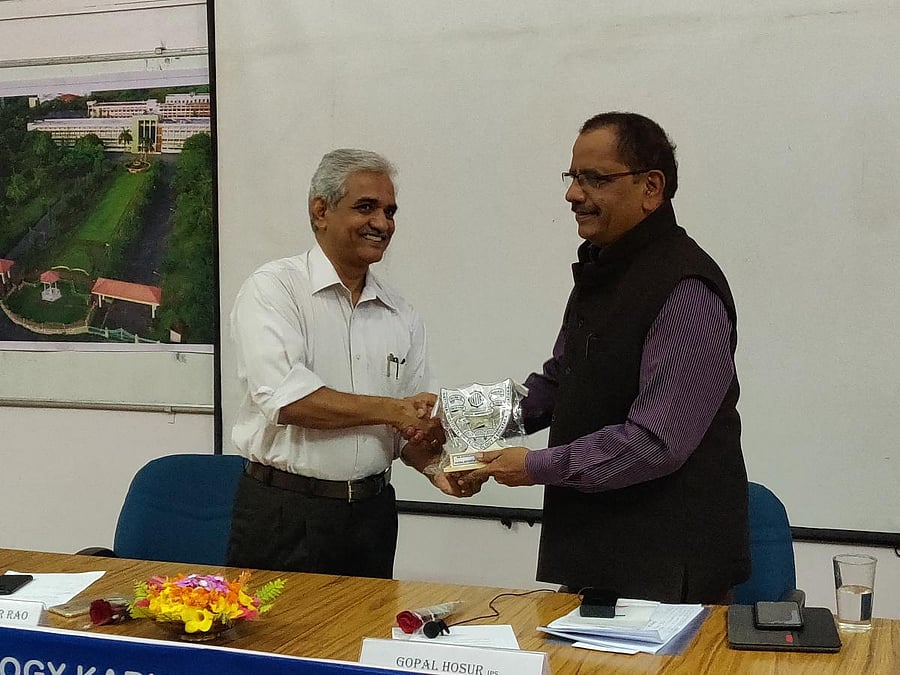Prof Umamaheshwar Rao, director of NITK, Surathkal, (left) presents a memento to retired IGP Gopal Hosur, who spoke on the role of intelligence in good governance at NITK on Monday.
