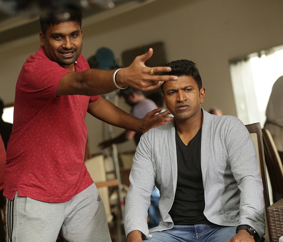 Pavan Wadeyar with actor Puneeth Rajkumar on the sets of ‘Natasaarvabhowma’.